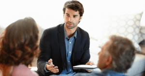 IPMI advisor explaining health insurance underwriting options to clients