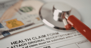 Group health insurance renewal statement showing a premium increase and questions about claims data in Singapore.